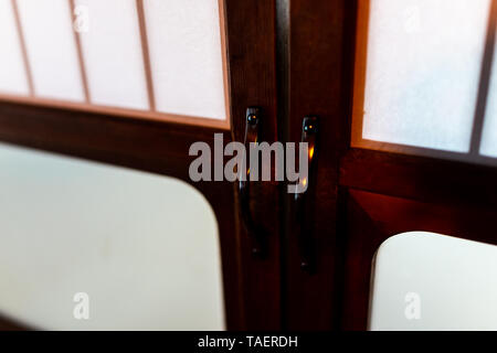 Traditional japanese house or ryokan with macro closeup of shoji sliding paper doors closed Stock Photo