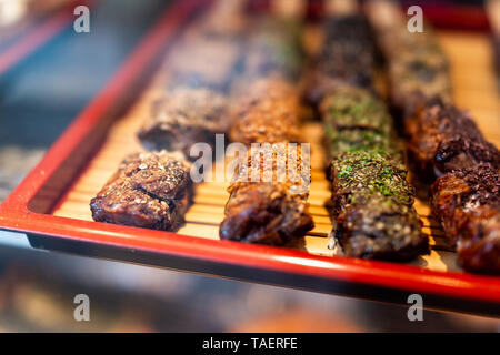 Closeup of dessert pastries with sugar on shelf tray display desserts in bakery shop cafe store in Takayama, Gifu Prefecture in Japan Stock Photo