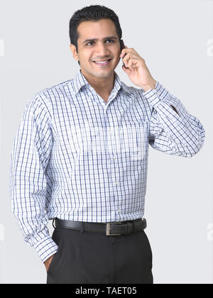 MAN TALKING ON A MOBILE PHONE Stock Photo