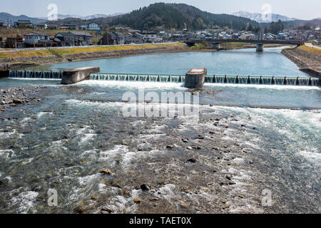 Toyama, Japan countryside rural area in Gifu prefecture, Hida with Ida river blue water near Etchu-Yatsuo Station during day Stock Photo