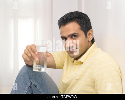 YOUNG MAN MAN DRINKING WATER Stock Photo