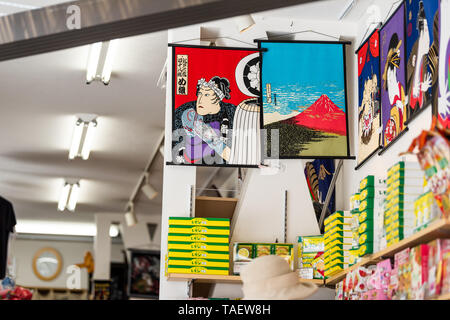 Nikko, Japan - April 4, 2019: Store interior in Tochigi prefecture view from street road with closeup of hanging traditional tapestry and nobody Stock Photo