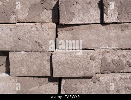 stack of gray pavement cobblestones, bricks. texture, construction. Stock Photo