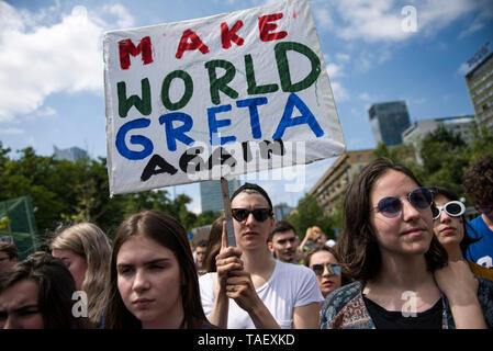 A protester seen holding a placard that says make world greta again during the demonstration. Young people who want to pay attention to the effects of climate change, protested on the streets of Warsaw. The Youth Strike for Climate is an initiative of pupils and students of Polish schools as they emphasize. The demonstration was inspired by 16-year-old activist Greta Thunberg, who started similar strikes in Sweden last year. Stock Photo