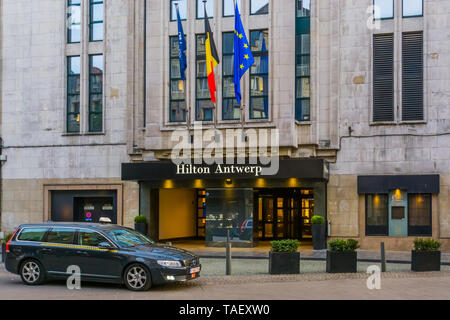 Antwerpen, Belgium, April 23, 2019, The entrance of the Hilton Hotel in Antwerp city with a taxi car waiting in front of the door Stock Photo