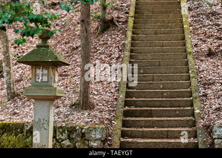 Takayama, Japan - April 9, 2019: Higashiyama walking course in historical city in Gifu Prefecture with stone steps stairs up in Shinmei shrine and sto Stock Photo