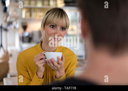 Colleagues having a break, talking and drinking coffee Stock Photo