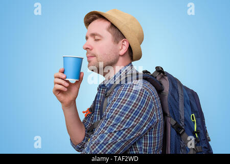 Young man wearing summer hat and holding cup Stock Photo