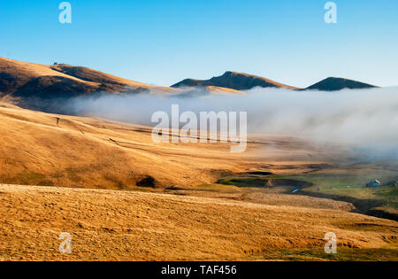 arid landscape with mountain fog Stock Photo