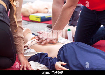 CPR course using automated external defibrillator device - AED Stock Photo