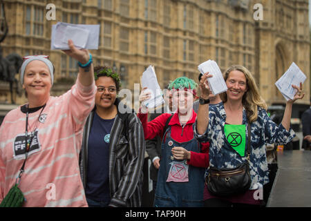 Campaigners from climate protest group Extinction Rebellion write letters to their Members of Parliament on Parliament Square. Various MPs and Jenny Jones, Baroness Jones of Moulsecoomb, assisted in delivering the letters as the group were barred access to Parliament by a police cordon.  Featuring: Atmosphere, View Where: London, United Kingdom When: 23 Apr 2019 Credit: Wheatley/WENN Stock Photo