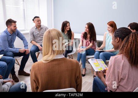 Group Of Multi-ethnic Friend Having Group Discussion Stock Photo