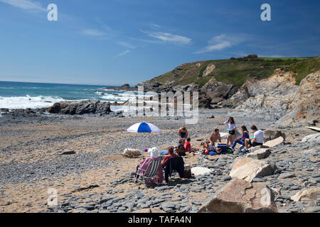 A view of the beach and cove at Gunwalloe on the west of the Lizard peninsula in Cornwall, UK Stock Photo