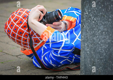 ExCel London, UK - 24th May 2019. Everyone is a star at Comicon, including the photographers. Thousands of cosplayers, gamers and lovers of film and TV fantasy and sci fi in costumes come together on the opening day of MCM Comicon at ExCel London. Credit: Imageplotter/Alamy Live News Stock Photo