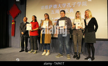 Novi Sad, Serbia. 24th May, 2019. Students hold their diplomas of the Chinese Proficiency Test, also known as HSK, during a ceremony marking the fifth anniversary of the Confucius Institute at the University of Novi Sad, in Novi Sad, Serbia, on May 24, 2019. Students of the Confucius Institute at the University of Novi Sad demonstrated their language skills and arts at a ceremony marking the fifth anniversary of the institute on Friday. Credit: Nemanja Cabric/Xinhua/Alamy Live News Stock Photo