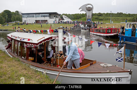 Falkirk, UK. 25th May, 2019. UK. Re-opening of the Forth and Clyde Canal celebrations beginning at The Falkirk Wheel a flotilla of steam boats, puffers, rowing boats and more had a dry weather start. Which was held back slightly by the Maryhill having to be towed away from smaller vessels by the Dalmore. The journey takes the vessels through Bonnybridge to final destination at Auchinstarry Marina. Stock Photo