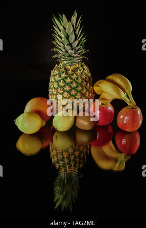 Fresh fruits reflect on black background. Isolated fruits Stock Photo