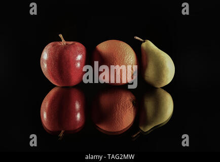 Fresh fruits reflect on black background. Isolated fruits Stock Photo