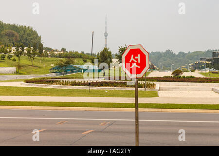 Pyongyang, North Korea - July 29, 2014: Road sign on the street in Pyongyang. Stock Photo