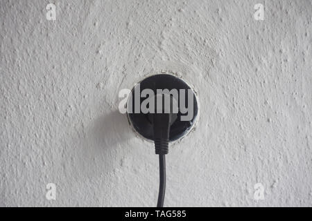 plug in socket for electricity on old wall Stock Photo