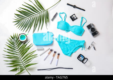 Composition with female items and photo camera on white background Stock Photo