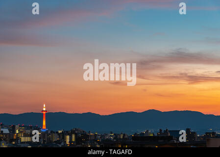 Colorful Kyoto Tower at night. Kyoto city skyline from above at dusk. Stock Photo