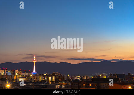 Colorful Kyoto Tower at night. Kyoto city skyline from above at dusk. Stock Photo