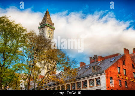 The custom house clock tower in the city of Boston Massachusetts cityscape on a cloudy blue sky day. Stock Photo