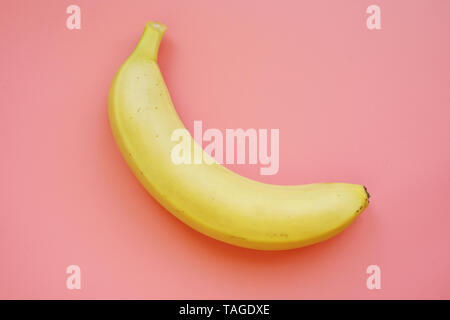Banana on a pink background. Colorful fruit pattern. Stock Photo