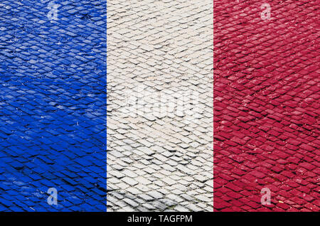 Abstract image of a French flag blended with a real cobblestone road pattern. Image related to the famous French road cycling races on the cobblestone Stock Photo
