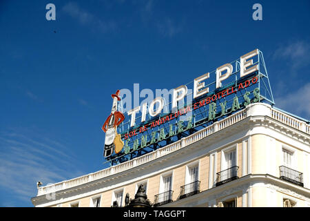 Iconic Tio Pepe sherry neon sign in daylight; Puerta del Sol square in downtown Madrid, Spain. Stock Photo