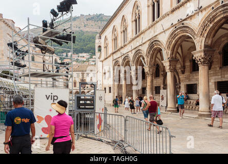 DUBROVNIK, CROATIA - AUGUST 13, 2015: Summer scene of the streets in Dubrovnik with locals and tourists. Streets of Dubrovnik are now used as set for  Stock Photo