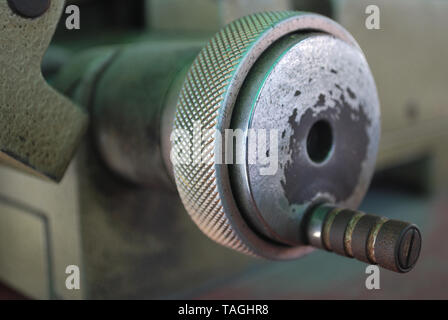 The handle of the small metal cutter serves to move the metal toward the metal cutting blade. Stock Photo