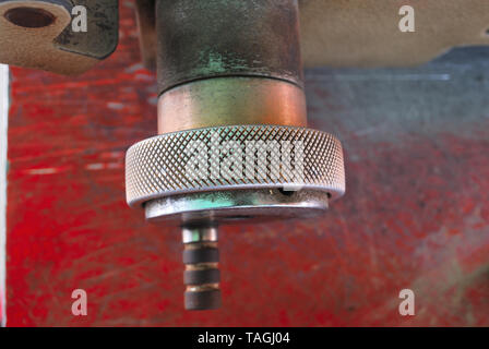 The handle of the small metal cutter serves to move the metal toward the metal cutting blade. Stock Photo