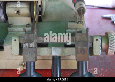 The small metal handle of the metal cutter serves to move the metal toward the metal cutting blade. Stock Photo