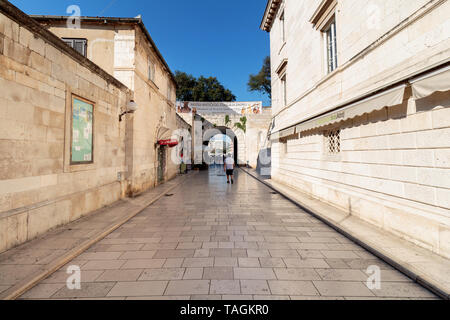 ZADAR, CROATIA - JULY 10, 2016: Street leading to the passage through the walls of Zadar Stock Photo