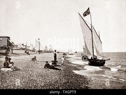 A late 19th Century view of  yachts from the beach at Aldeburgh, an English town on the North Sea coast in the county of Suffolk, to the north of the River Alde. Originally Aldeburgh was a leading Tudor port, and had a flourishing ship-building industry, but its importance as a port declined as the River Alde silted up and larger ships could no longer berth. It survived mainly on fishing until the 19th century, when it also became a seaside resort. Stock Photo