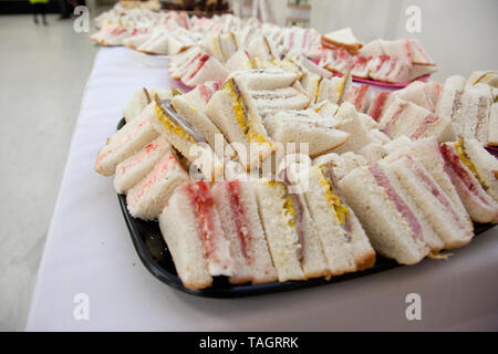 Roast beef and mustard, and cream cheese and cherry finger sandwiches Stock Photo