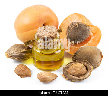 Apricot kernel oil and apricot kernels isolated on the white background ...