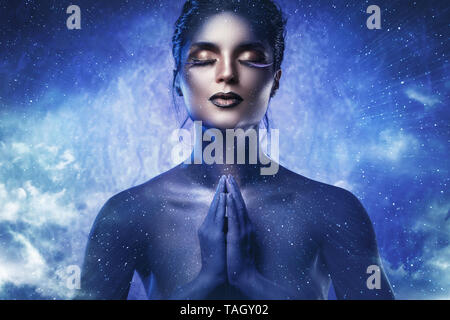 Goddess of the universe. Beautiful model in creative image of fantasy ...
