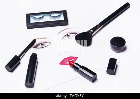 Face chart and different makeup objects and cosmetics on white background Stock Photo