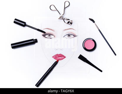 Face chart and different makeup objects and cosmetics on white background Stock Photo