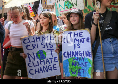 Students seen holding placards during the protest. Youth Strike for Climate Change Protest, calling on politicians and business leaders to protect the environment from greenhouse gas emissions and to address the impact it has on the environment. Stock Photo