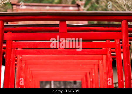 Takayama, Japan Higashiyama walking course in historical city in Gifu Prefecture with many red torii gates pattern of Toyokawa Jozan Inari Shrine Stock Photo