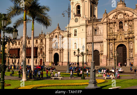 Lima, Peru - April 21, 2018: View of main square and Cathedral on sunny afternoon with many tourists Stock Photo