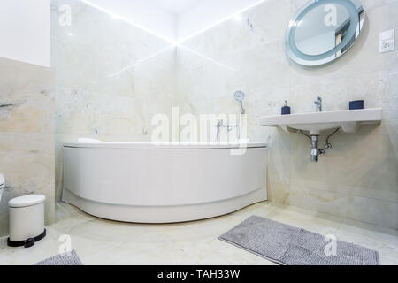 detail of a corner shower jacuzzi with wall mount shower attachment Stock Photo