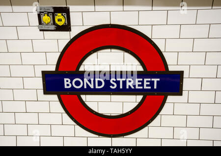 A London Underground emblem on the wall at Bond Street London Underground station. Stock Photo