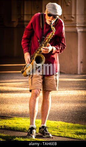 Jazz Player performing live in the park Stock Photo