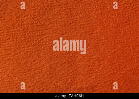 Close up of orange colored paper texture, background. High resolution photo. Stock Photo
