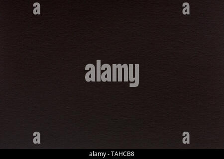 Black to black background. Dark paper with grainy texture. High quality texture in extremely high resolution. Stock Photo